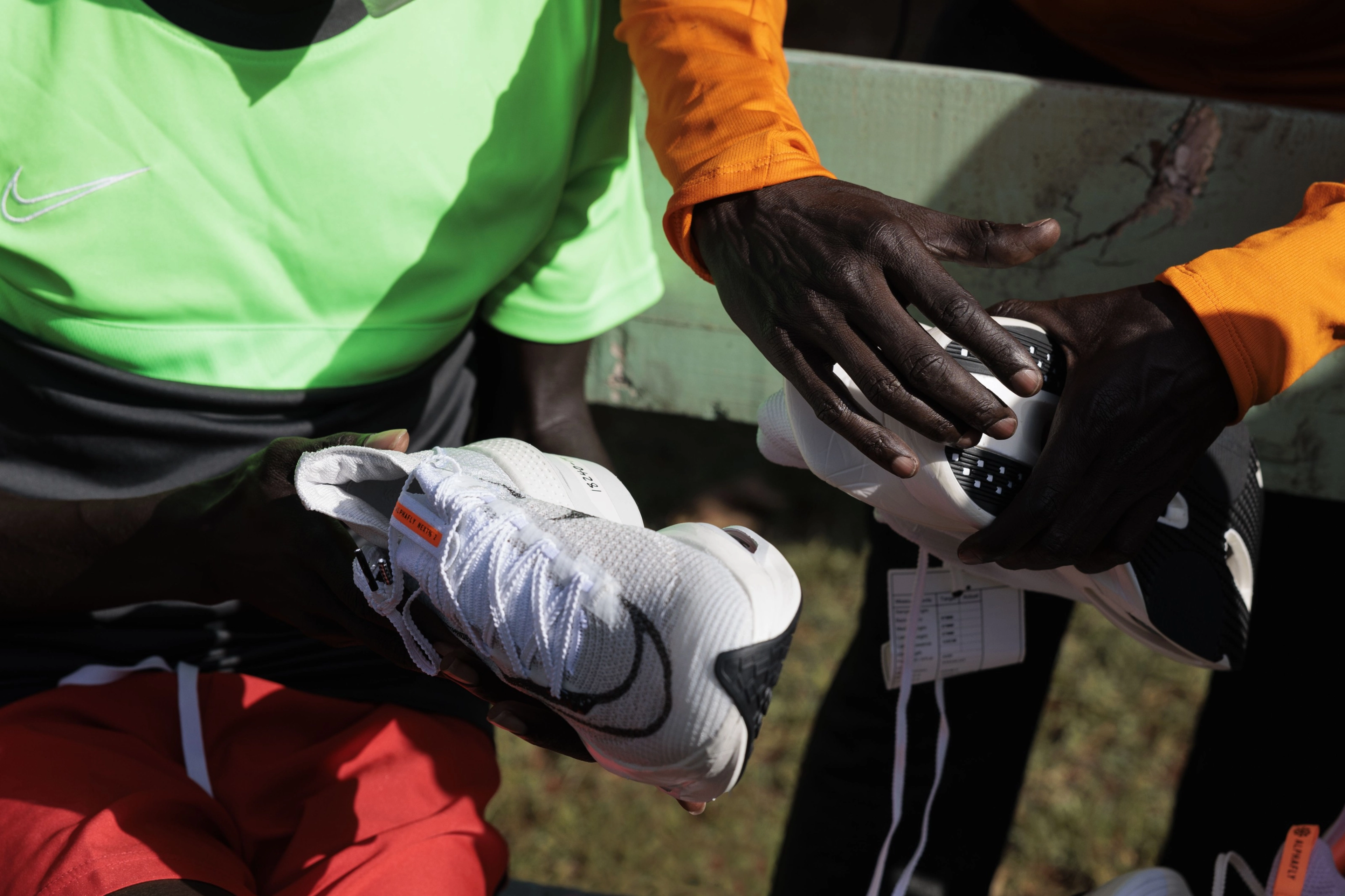 Close up view of designers and developers hands holding the Nike Alphafly 3 in Keptagat, Kenya to provide design input.