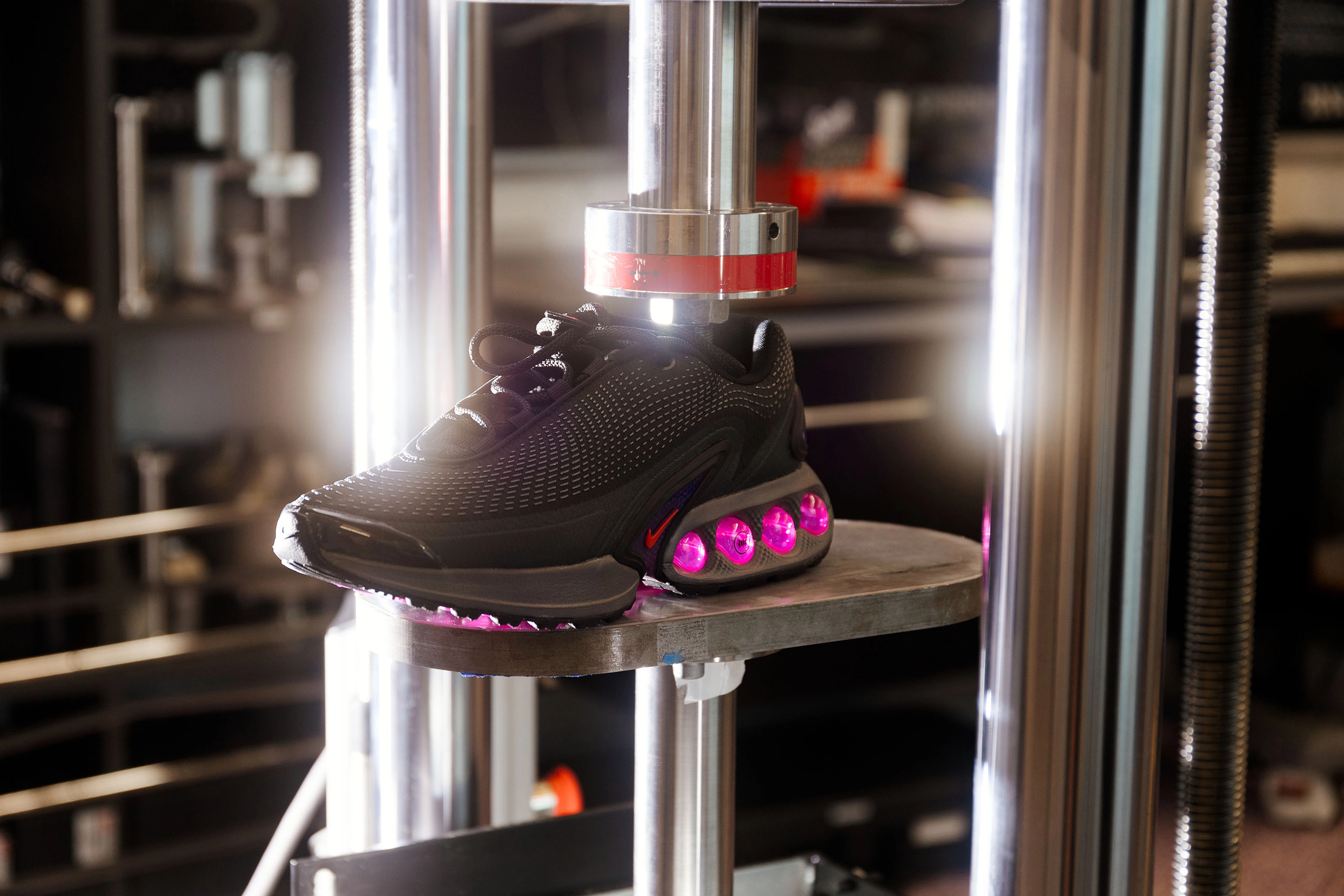 The Nike Air Max Dn's air unit durability being tested out in the Nike Sport Research Lab with a durability testing machine.