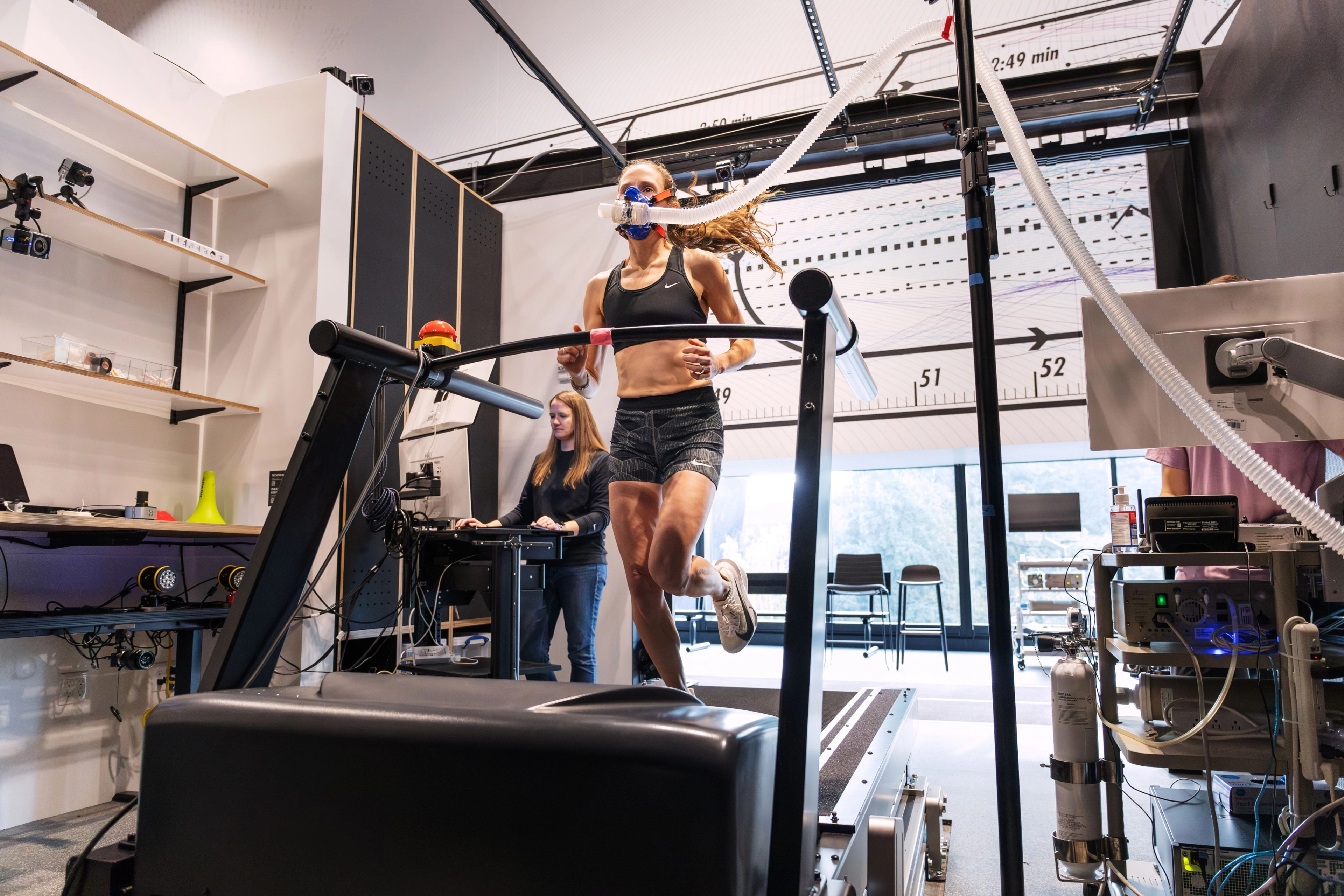 An athlete testing the Nike Alphafly 3 on a treadmill in the Nike Sports Research Lab