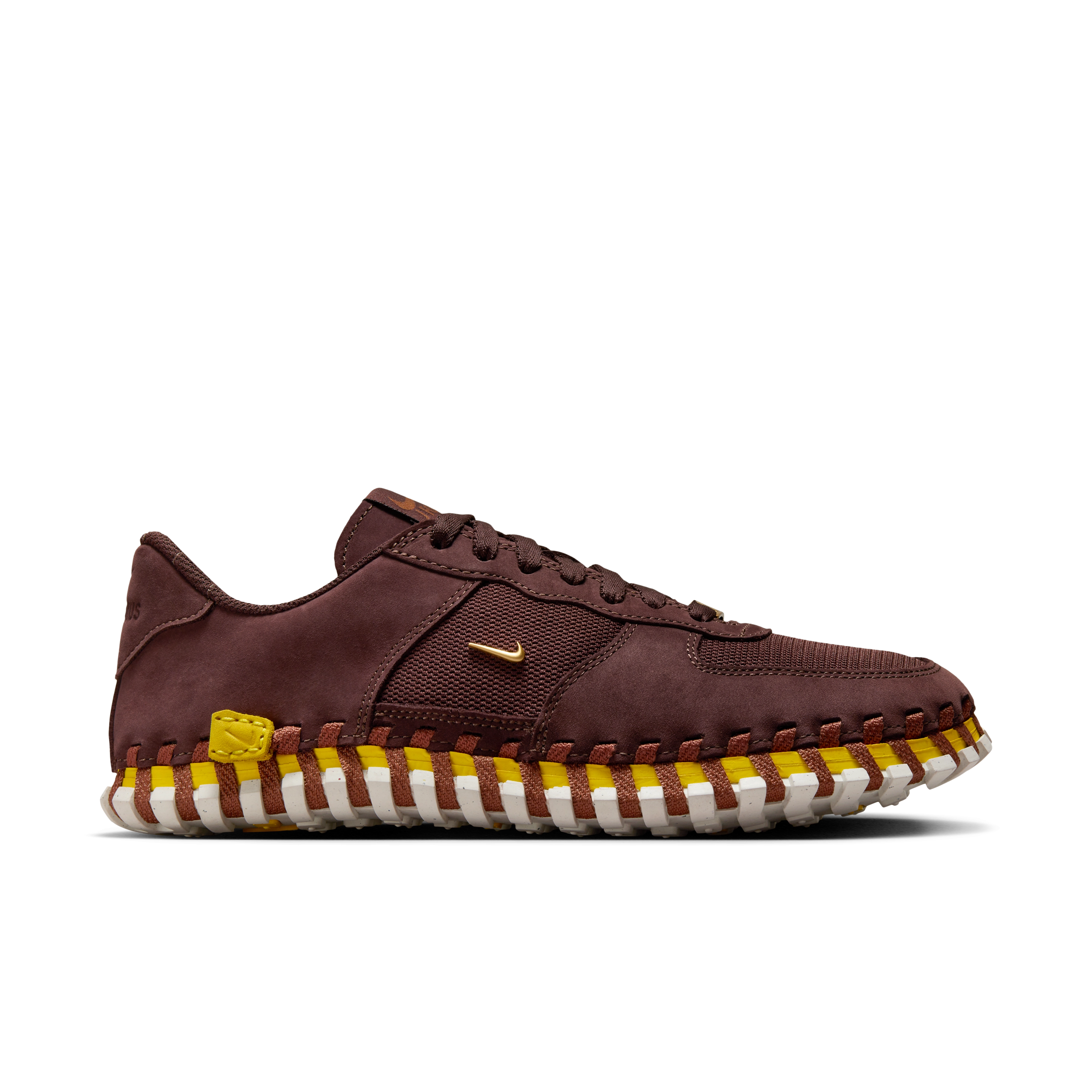 Right view of a Nike x Jacquemus J Force 1 Low LX SP with Earth brown upper, tour yellow midsole, and white sole. Includes, brown laces and AF1 lace tag in gold metal. There is a small metallic gold Swoosh on the shoe's side. The shoe floats on a black background.