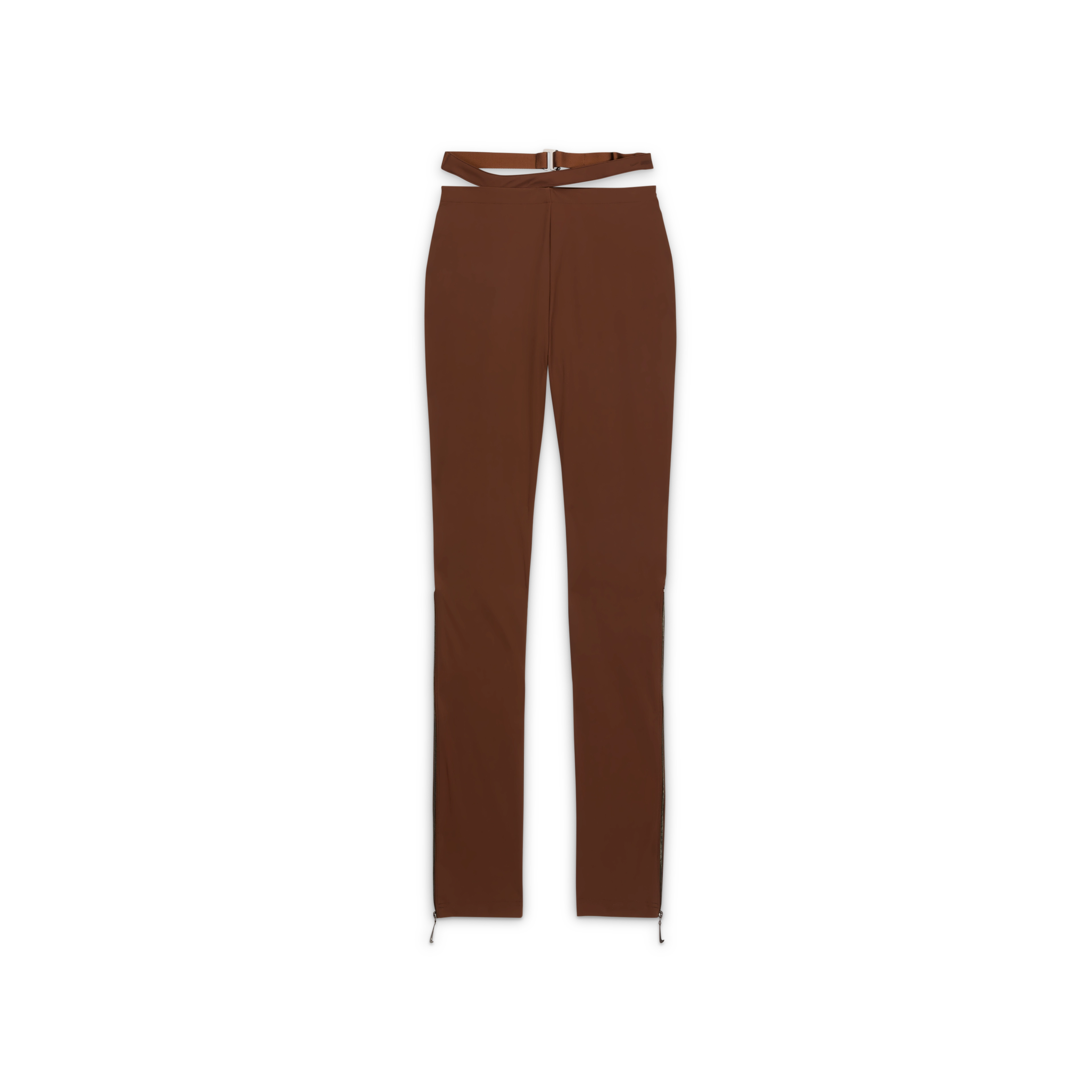 Overhead view of the Nike x Jacquemus Women's Pant in cacao wow brown. These form-fitting, stretchy pants includes zippers from the knee down, which have a silver zipper pull in the shape of a Swoosh. The strappy waistband is attached but separated from the waistband. The pant floats on a black background.