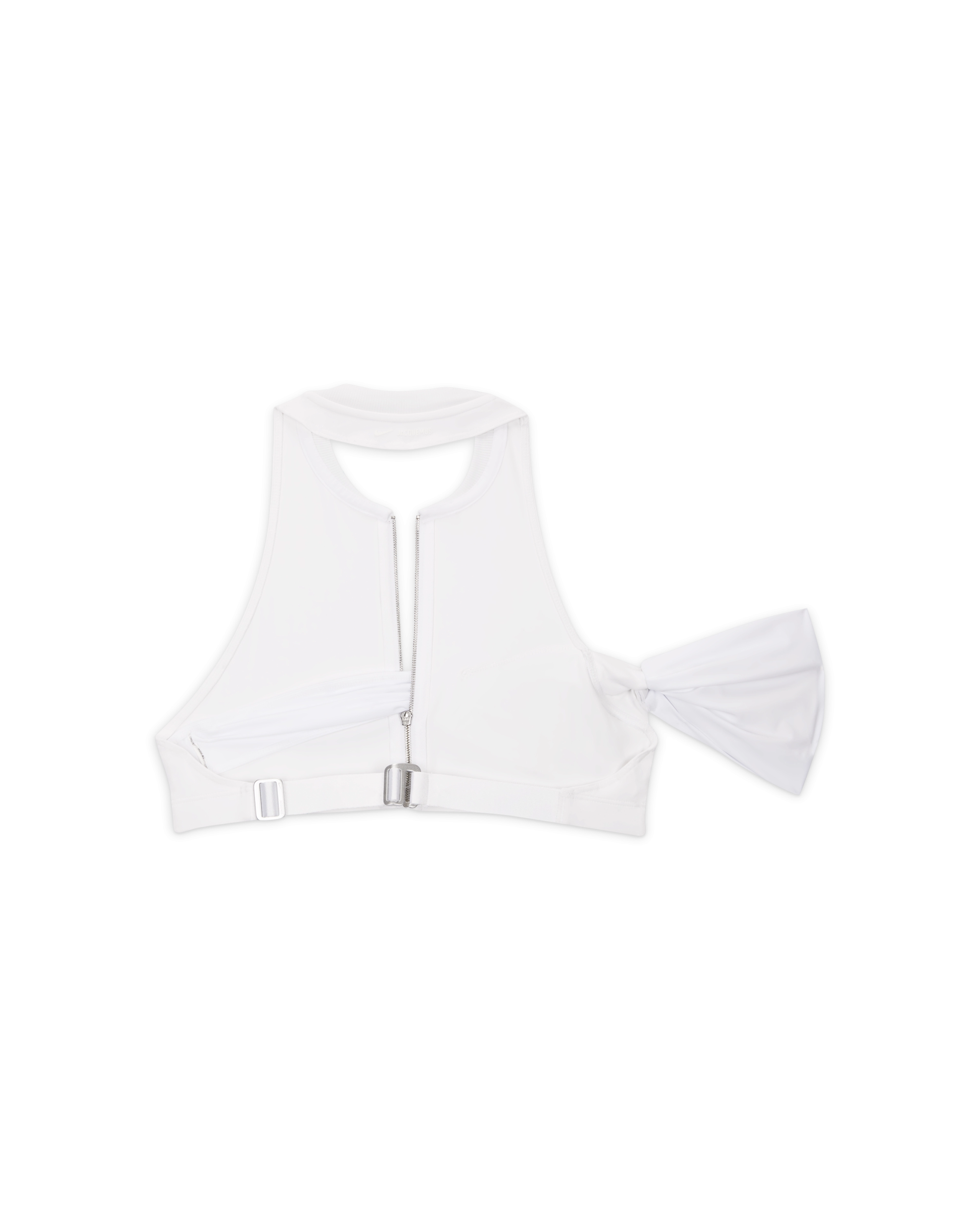 Back overhead view of the Nike x Jacquemus Halter Neck Sleeveless Crop Top in white. We see the silver closure hardware on the back and the white arm band material positioned to the right side. The piece floats on a black background.
