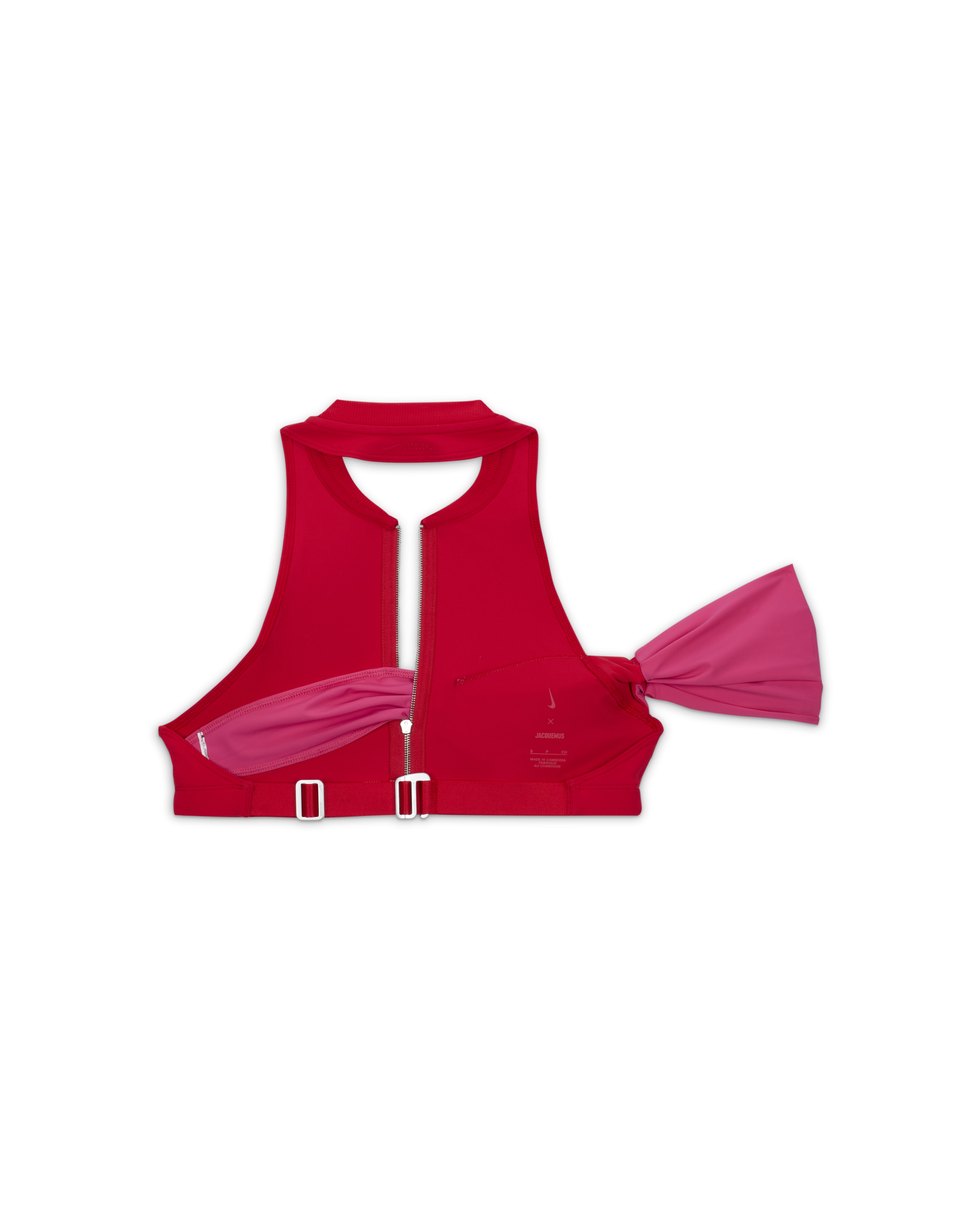 Back overhead view of the Nike x Jacquemus Halter Neck Sleeveless Crop Top in university red and watermelon pink. We see the silver closure hardware on the back and the pink arm band material positioned to the right side. The piece floats on a black background.