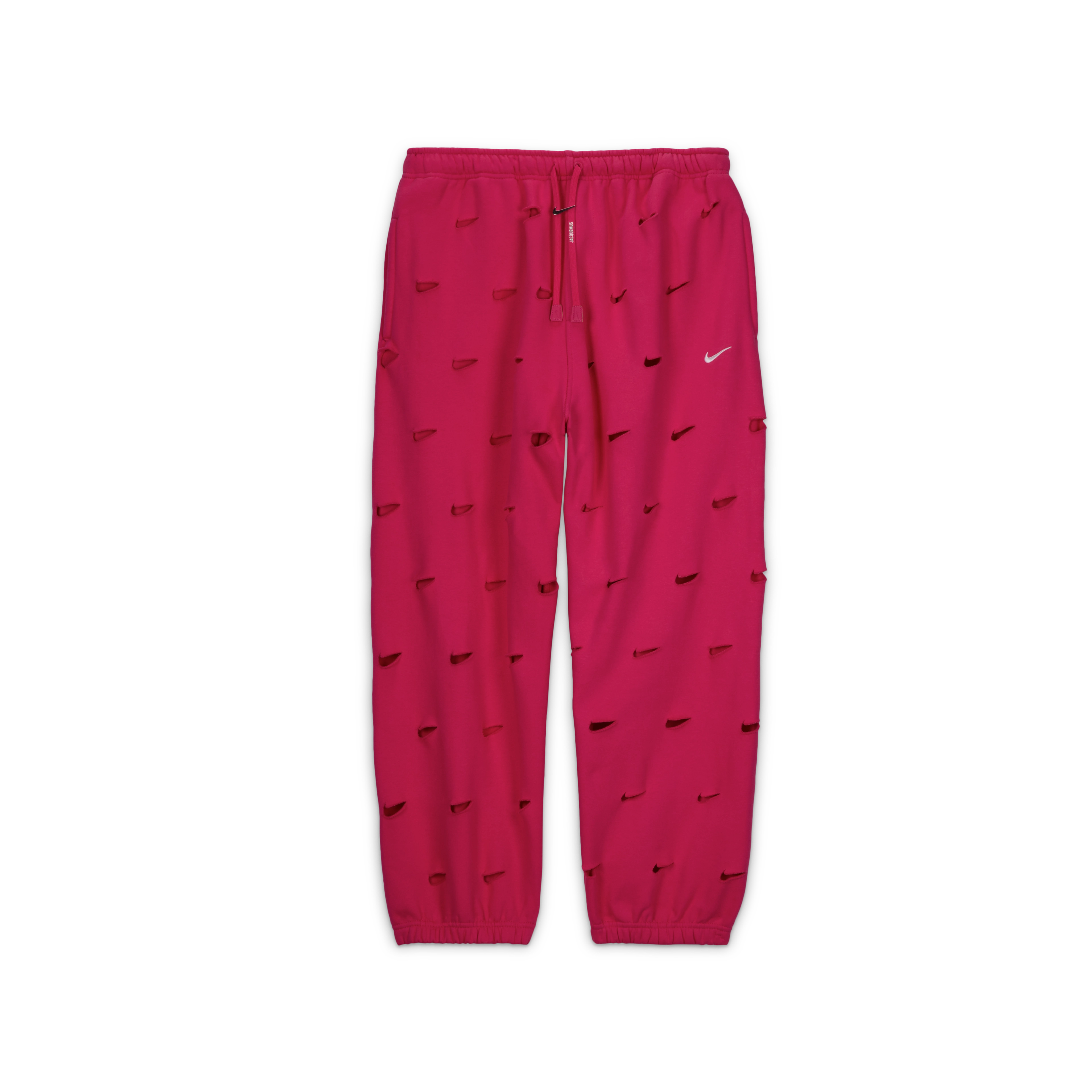 Overhead view of the Nike x Jacquemus Swoosh Pant in watermelon pink. Laser cut Swooshes are placed over the entire pant and there is a silver Swoosh logo adorning the drawcord. The pant floats on a black background.