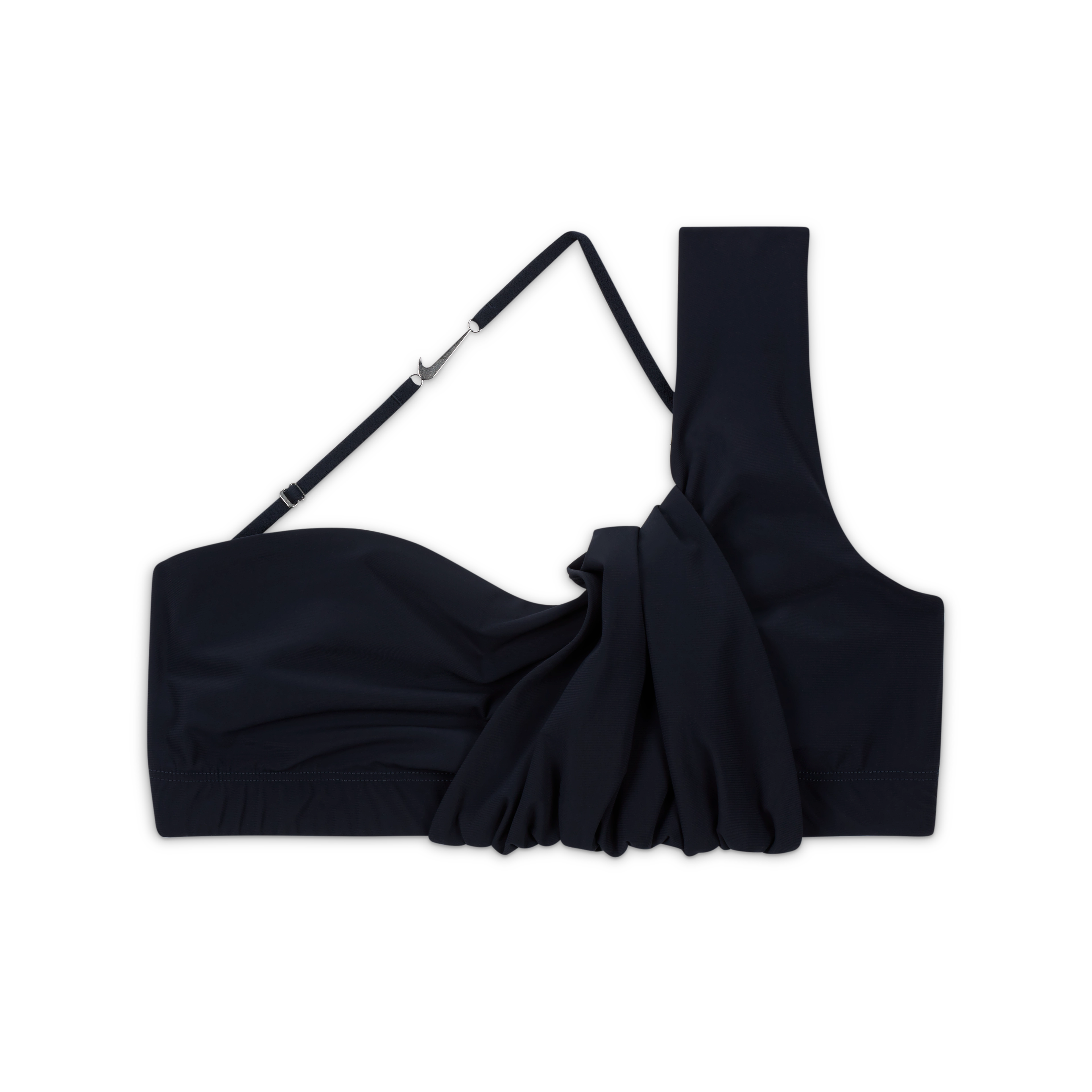 Overhead view of the Nike x Jacquemus Women's Top in dark obsidian. A layered, ruched design has one over-the-shoulder strap and one thin cross body strap with a silver Swoosh metal detail. The top floats on a black background.