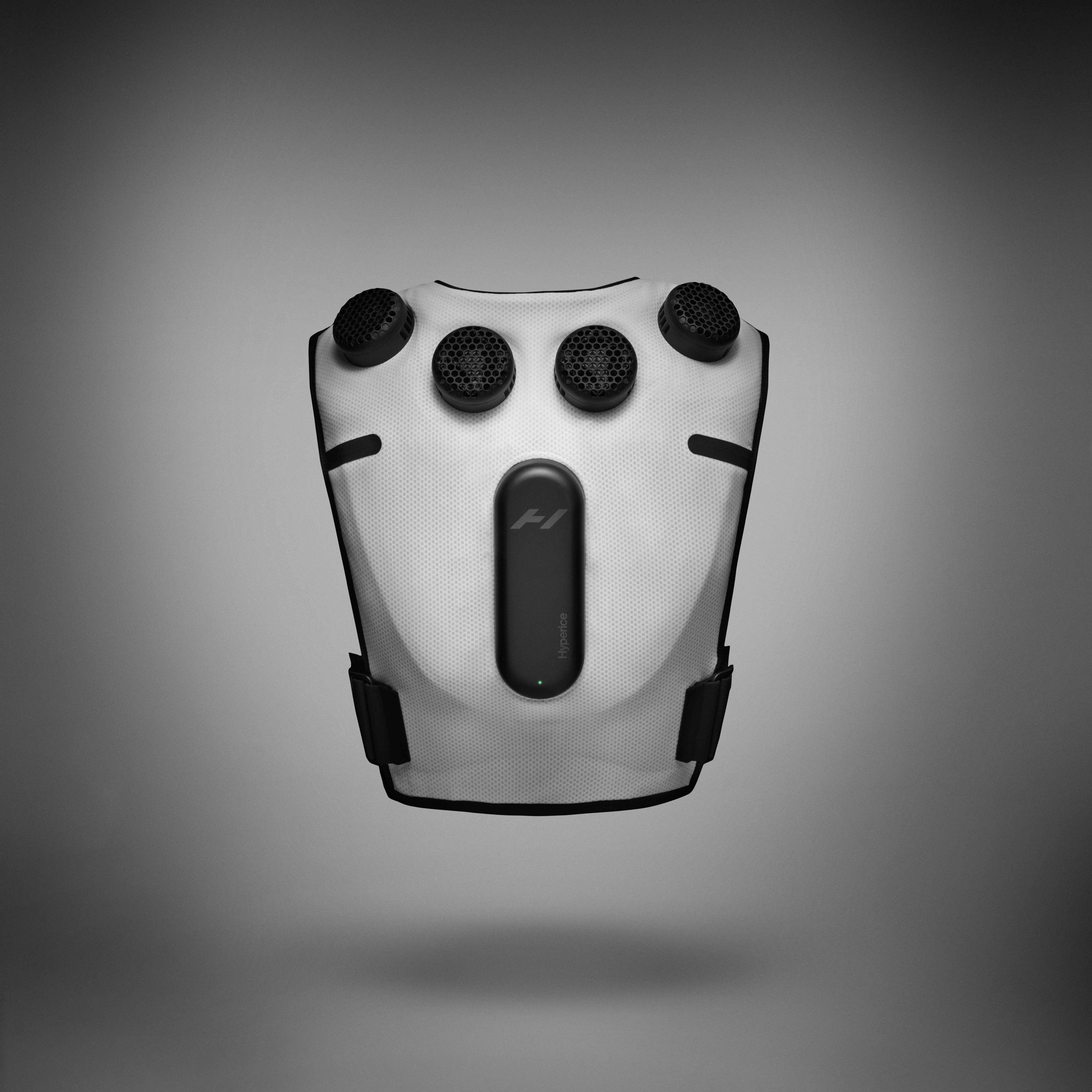 Back view of Nike x Hyperice Vest, shown in white with black thermal modules and compression unit. Vest floats above a grey background, casting a shadow underneath.