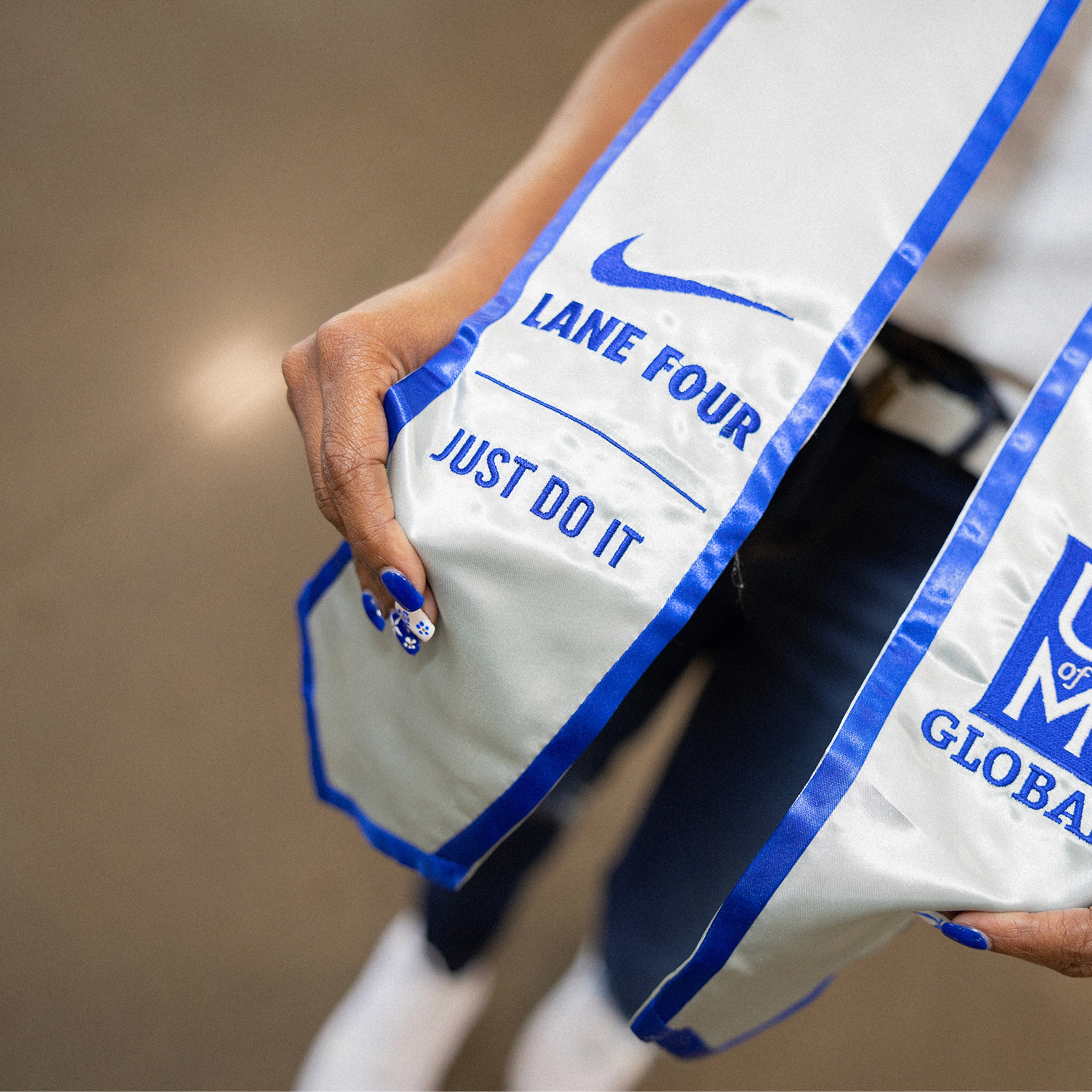 white and blue graduation sash