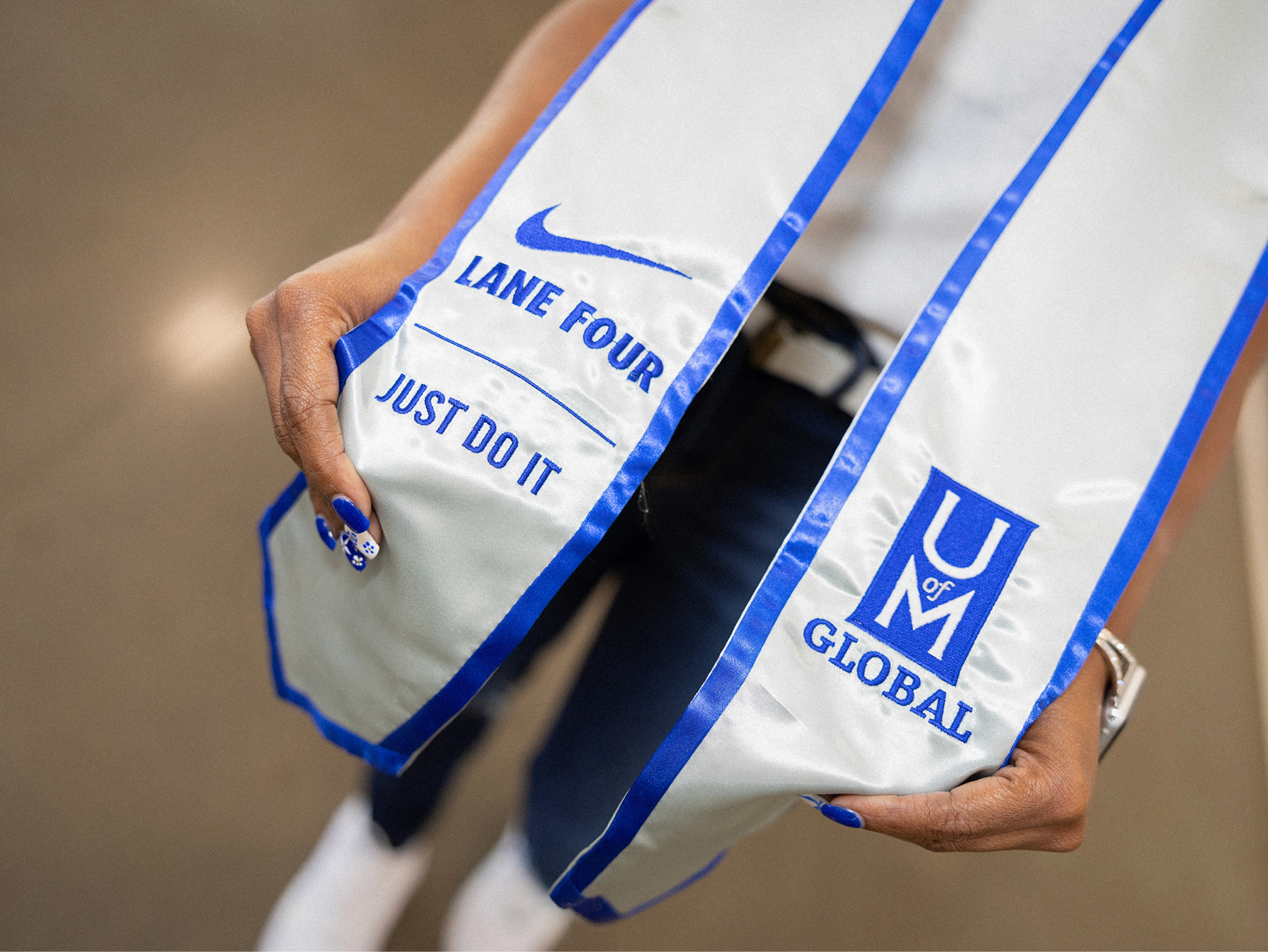 white and blue graduation sash