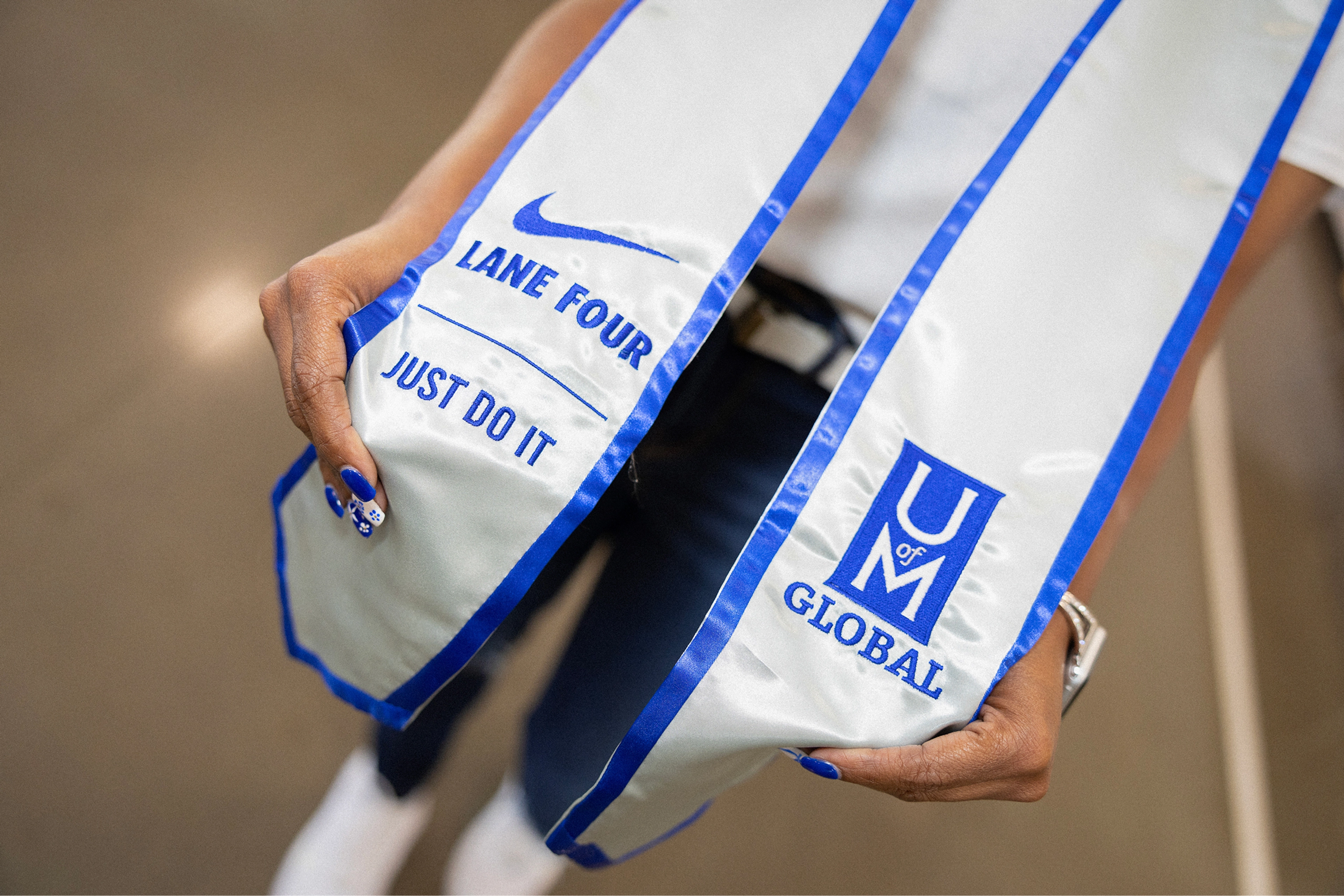 white and blue graduation sash