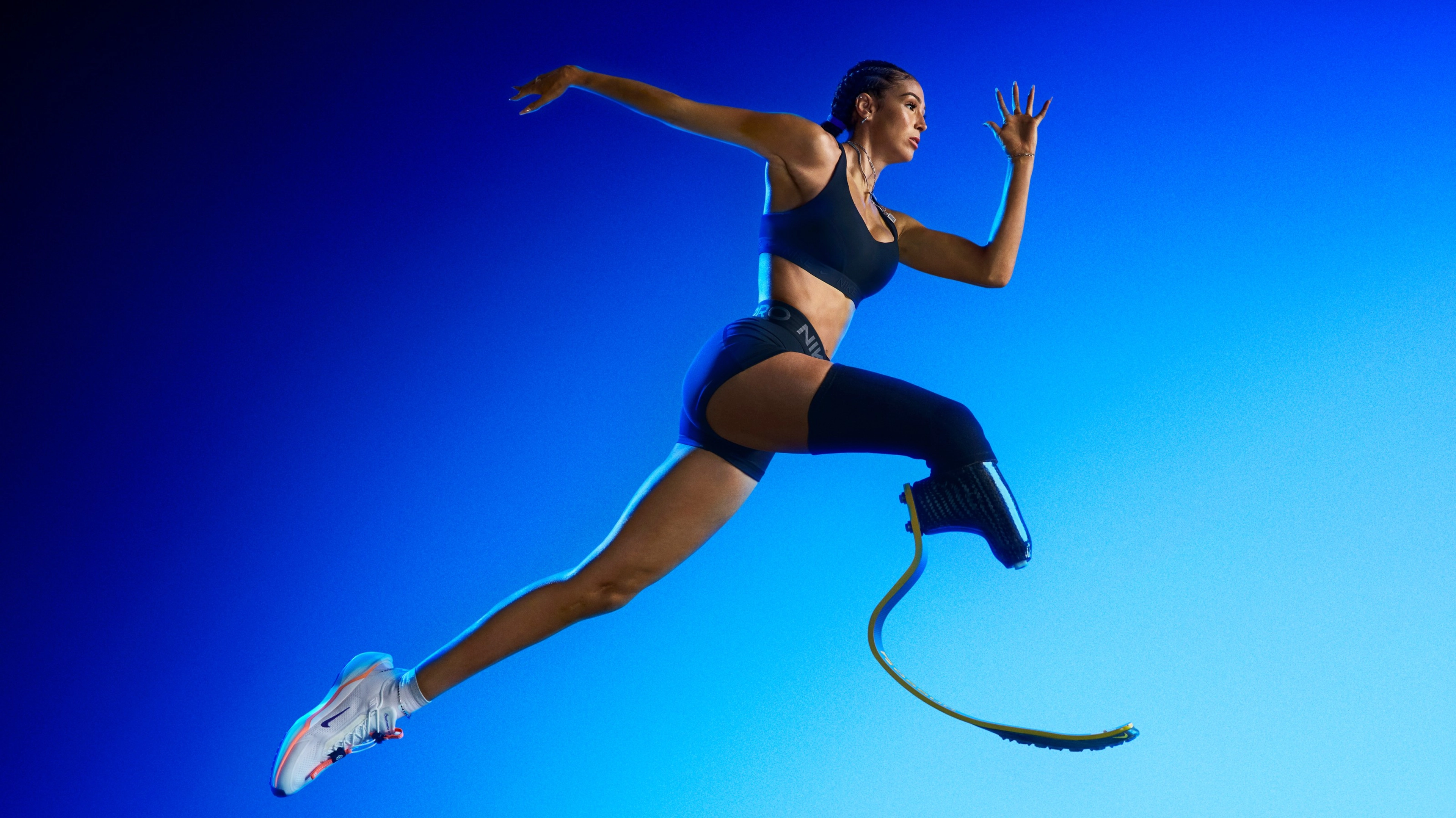 American long jumper and sprinter Beatriz Hatz in mid air jumping while wearing the Nike Pegasus EasyOn