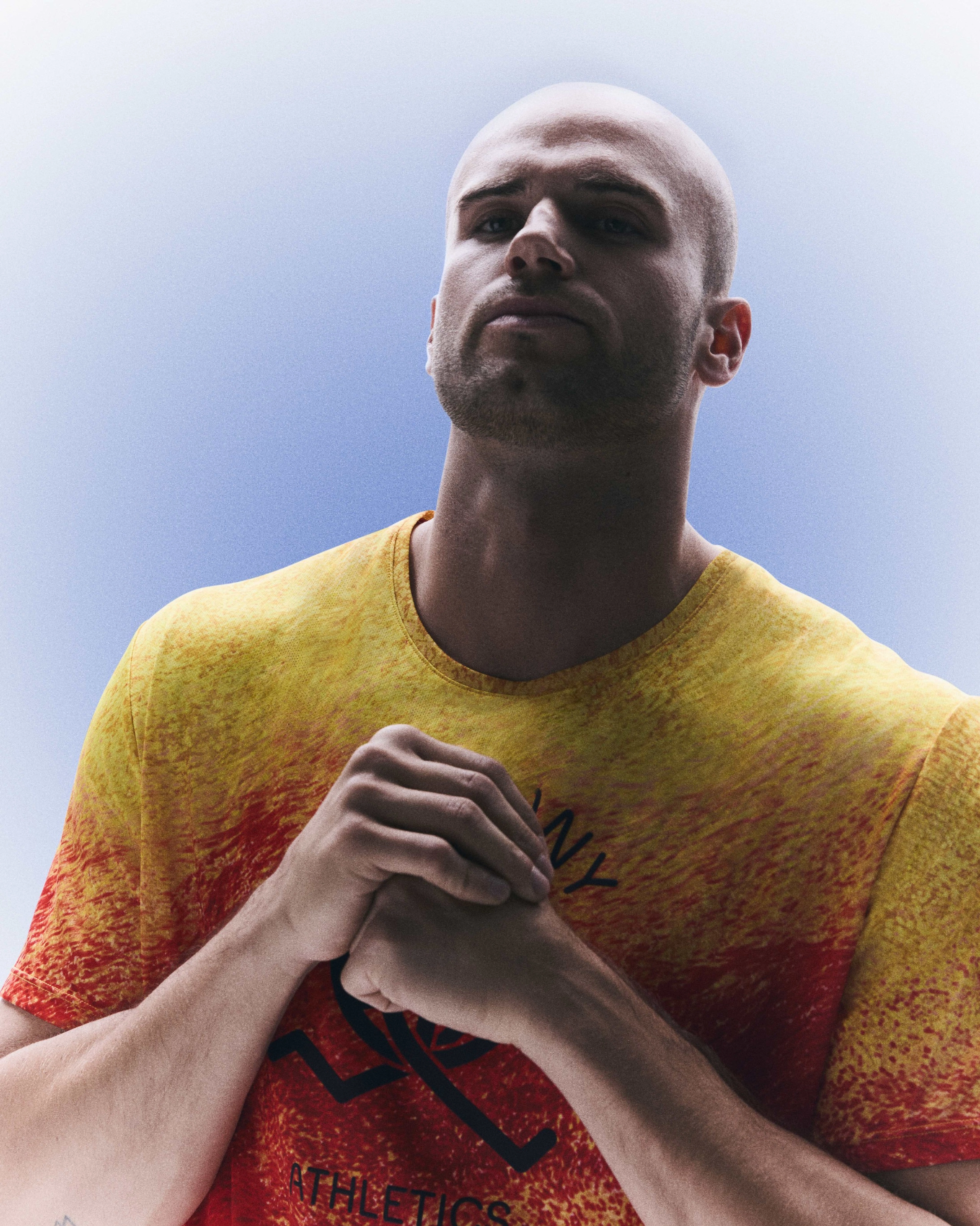 Julian Weber with his hands clasped while wearing his Germany track and field kit uniform.