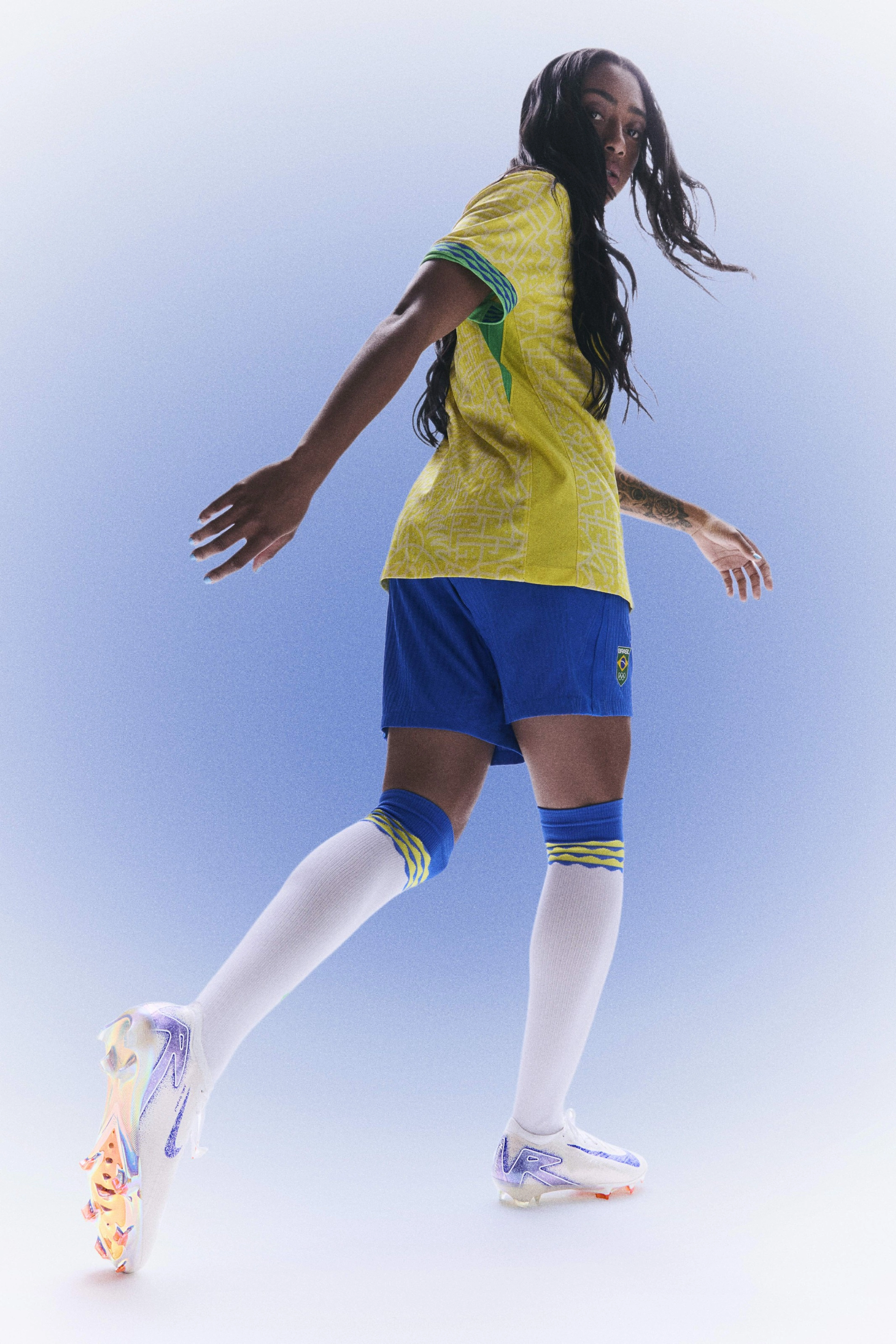 Kerolin Nicoli Israel Ferraz looking over her shoulder while wearing her Brazil global football kit uniform.