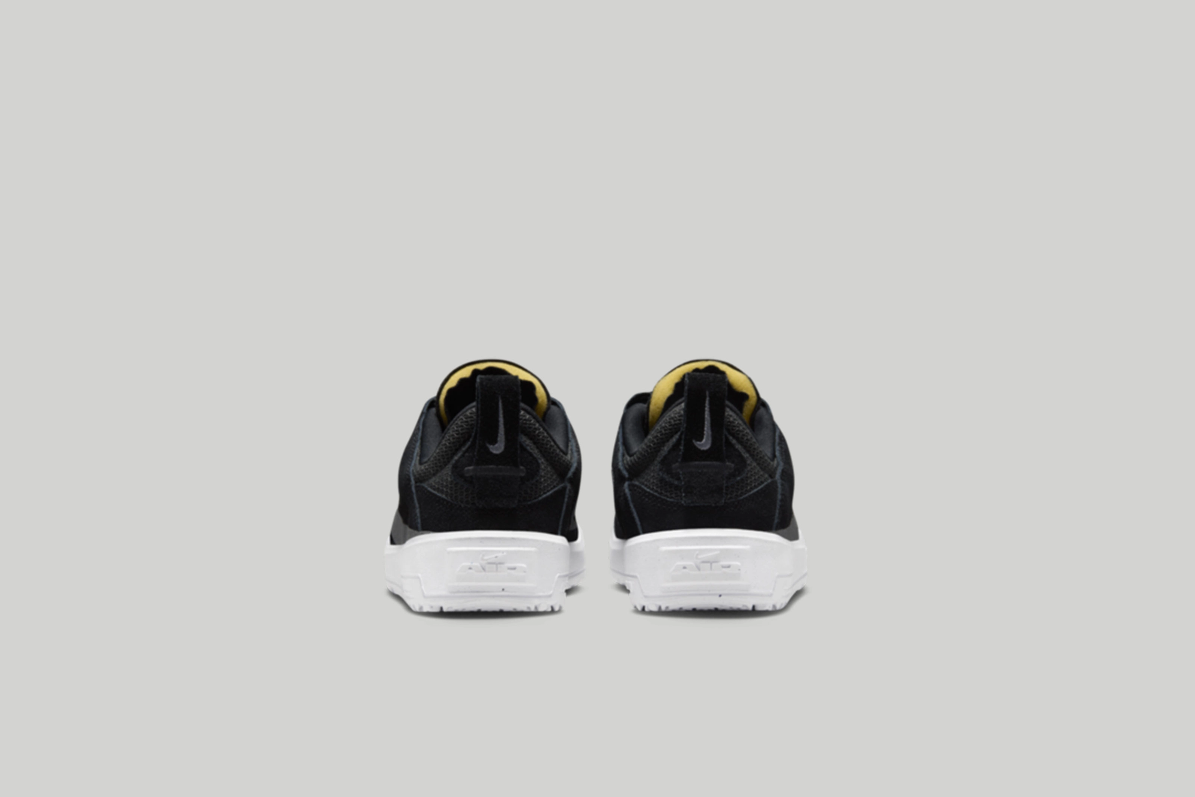 Back view of the kids Nike SB Day One in black.