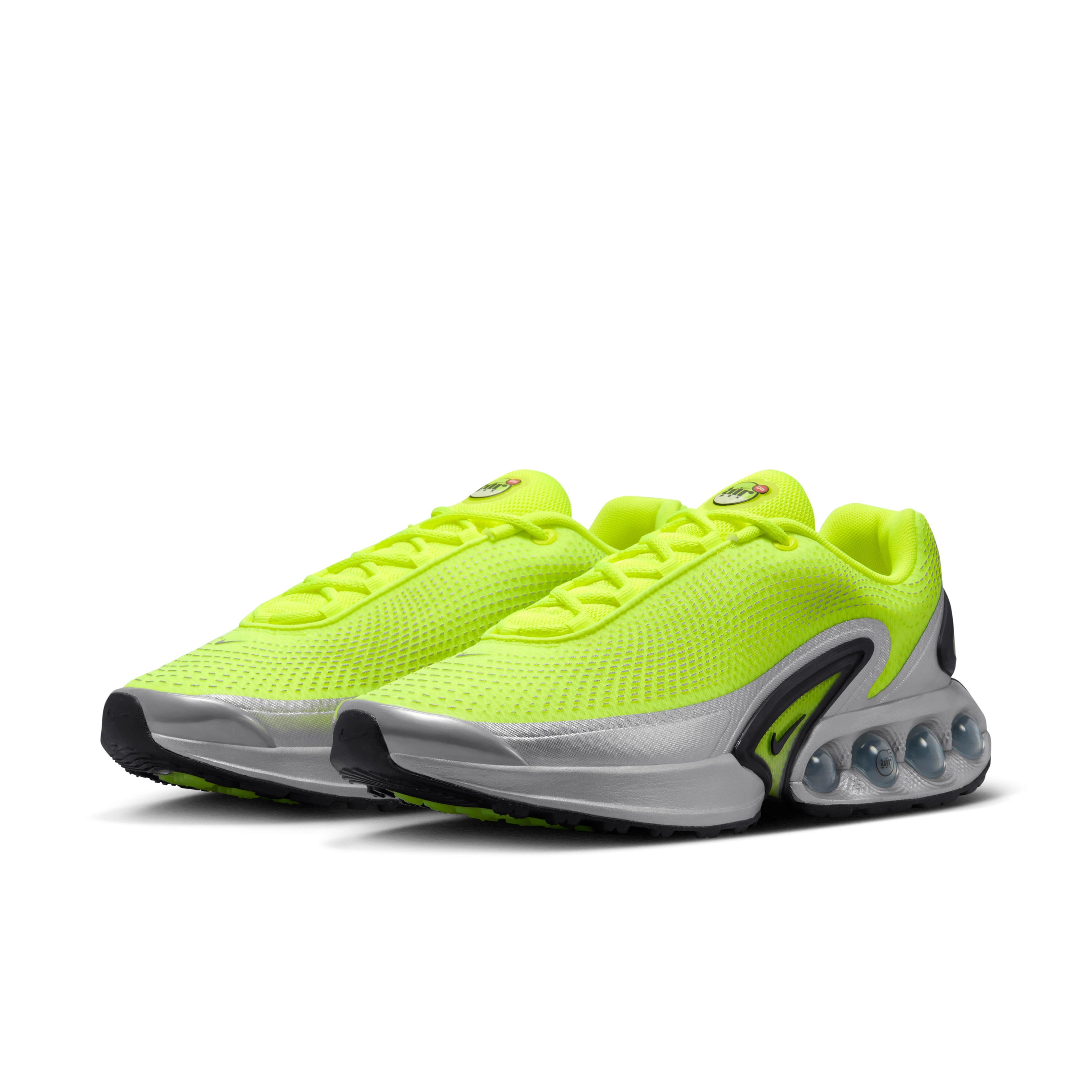Front angled view of the men's Nike Air Max Dn in volt glow, a flourescent green color