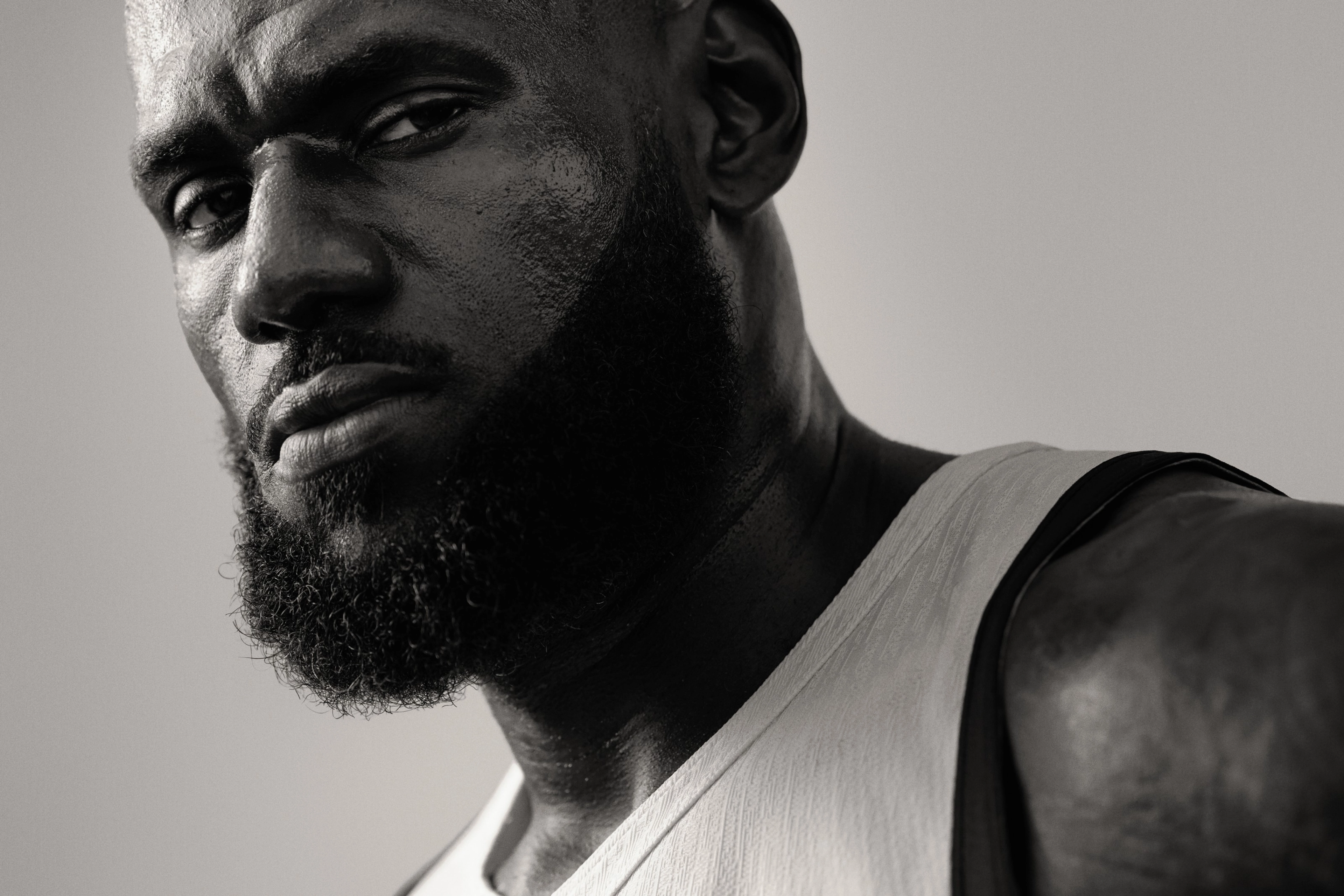 Black and white close up of Lebron James looking directly at the camera.