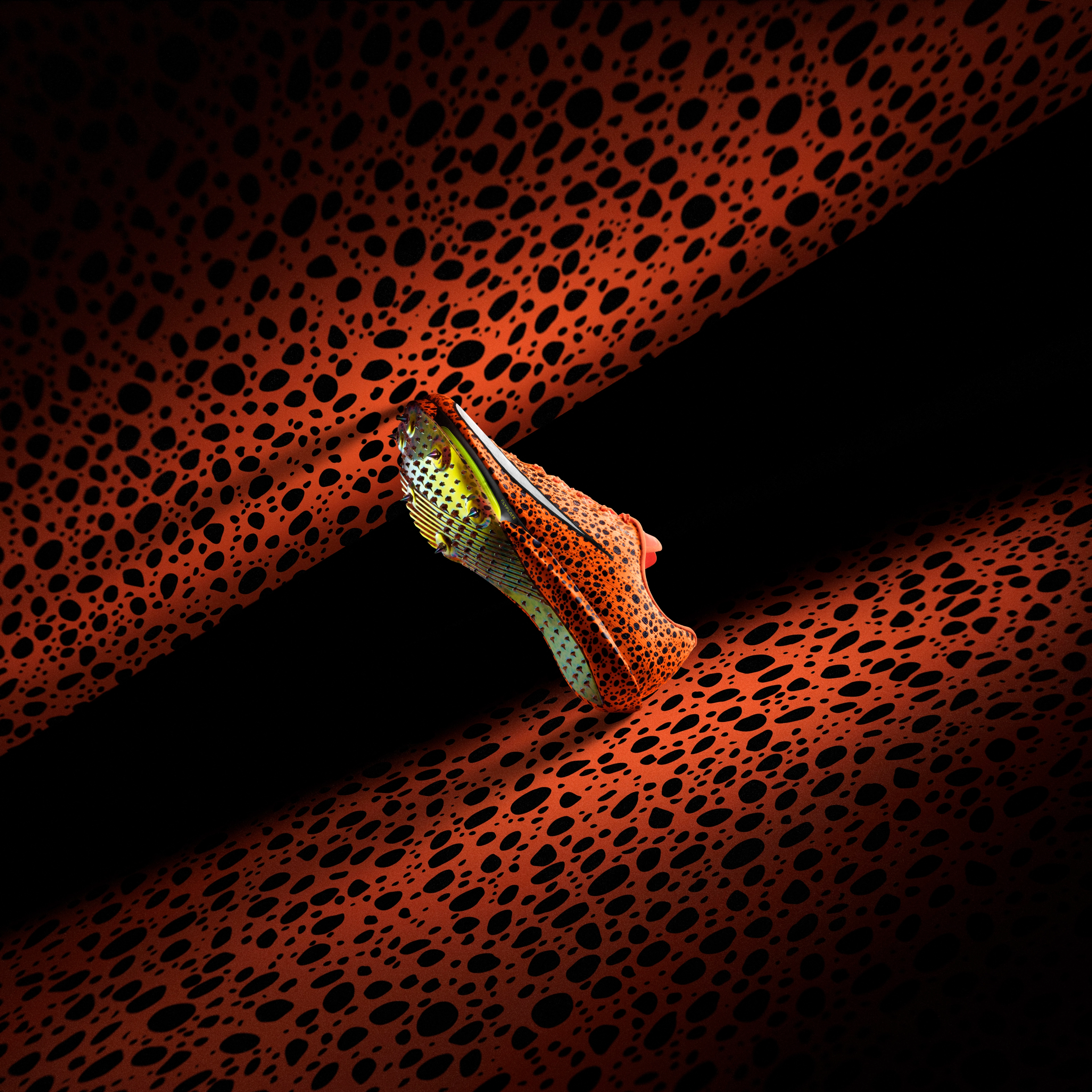 Underside view of the Nike Maxfly 2 in electric pack color way that combines ostrich print and total orange