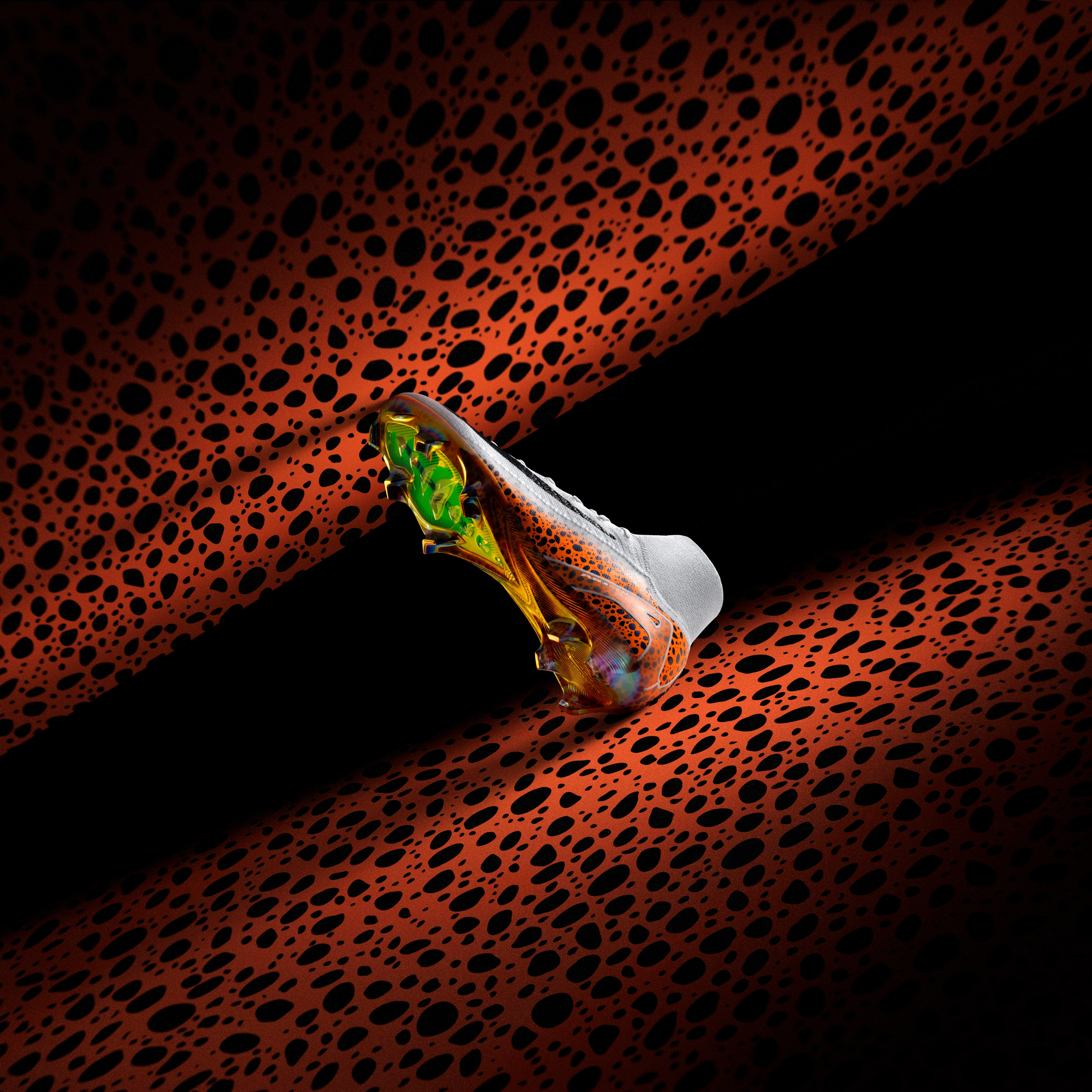 Underside view of a Nike Mercurial Superfly 10 football boot in the Electric colorway, which is a white upper with orange midsole featuring the blue/black speckled pattern, and a Volt and orange iridescent boot plate.