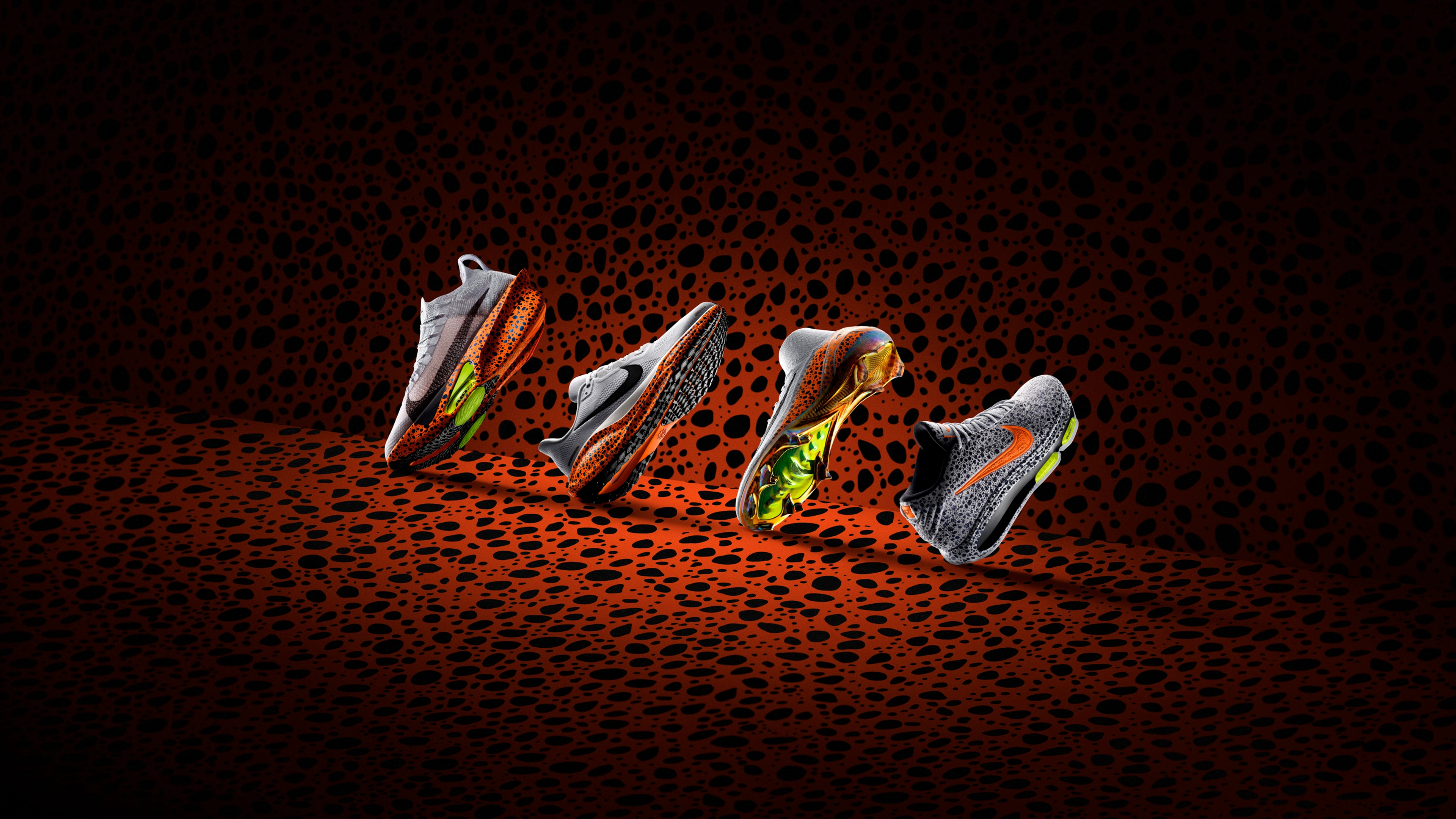 Side view of the 4 Hero shoes of the Nike Electric Pack, made up of the Nike Alphafly 3, Nike Pegasus 41, Nike Air Zoom Mercurial Superfly, and the Nike G.T. Hustle 3, all featuring the Electric pattern, orange with speckled blue/black spots.