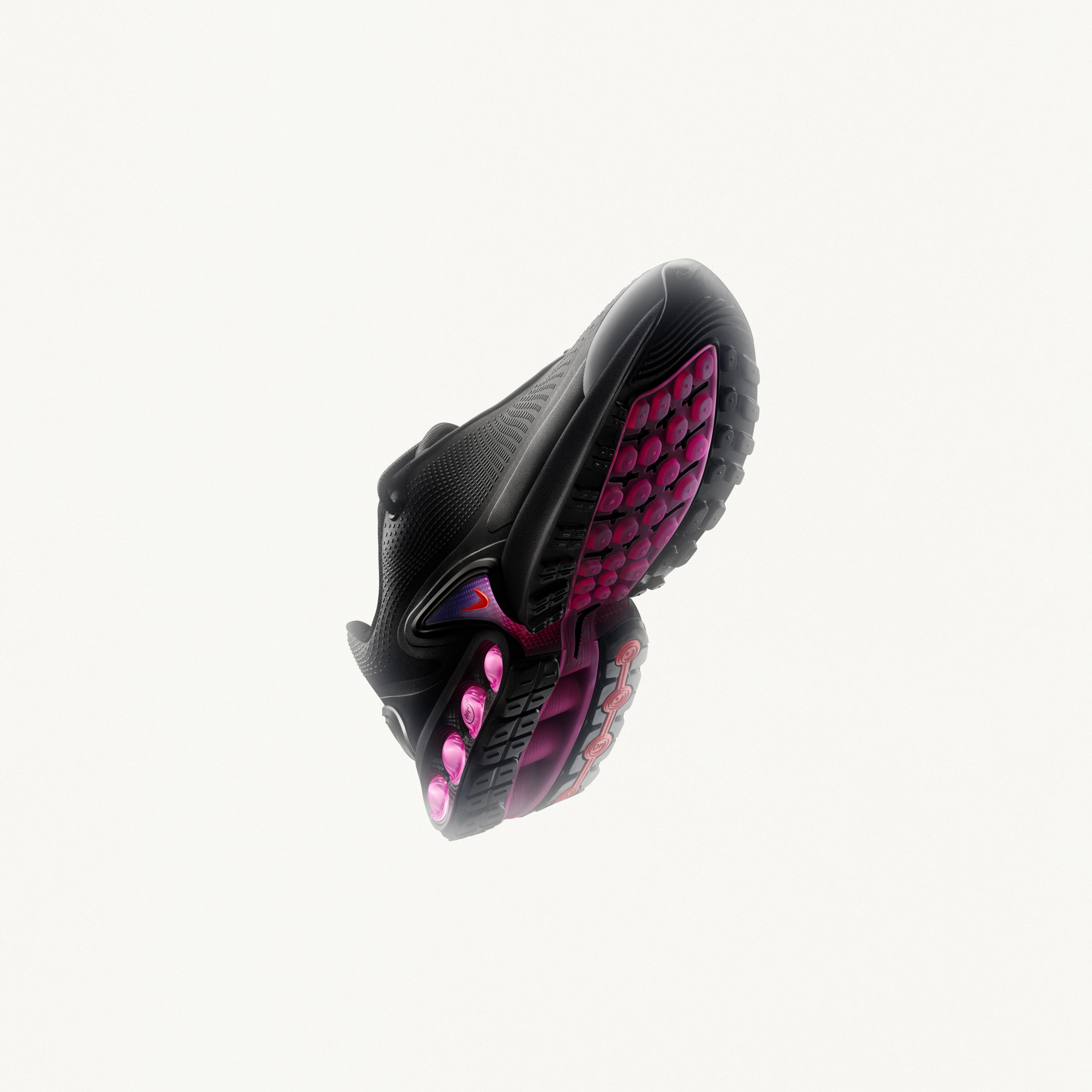 Underside view of the Nike Air Max Dn in black featuring a TPU shank arch clip in the mid foot, a TPU heel counter, phylon foam surrounding the air unit, and a rubber outsole wrapping around the heel.