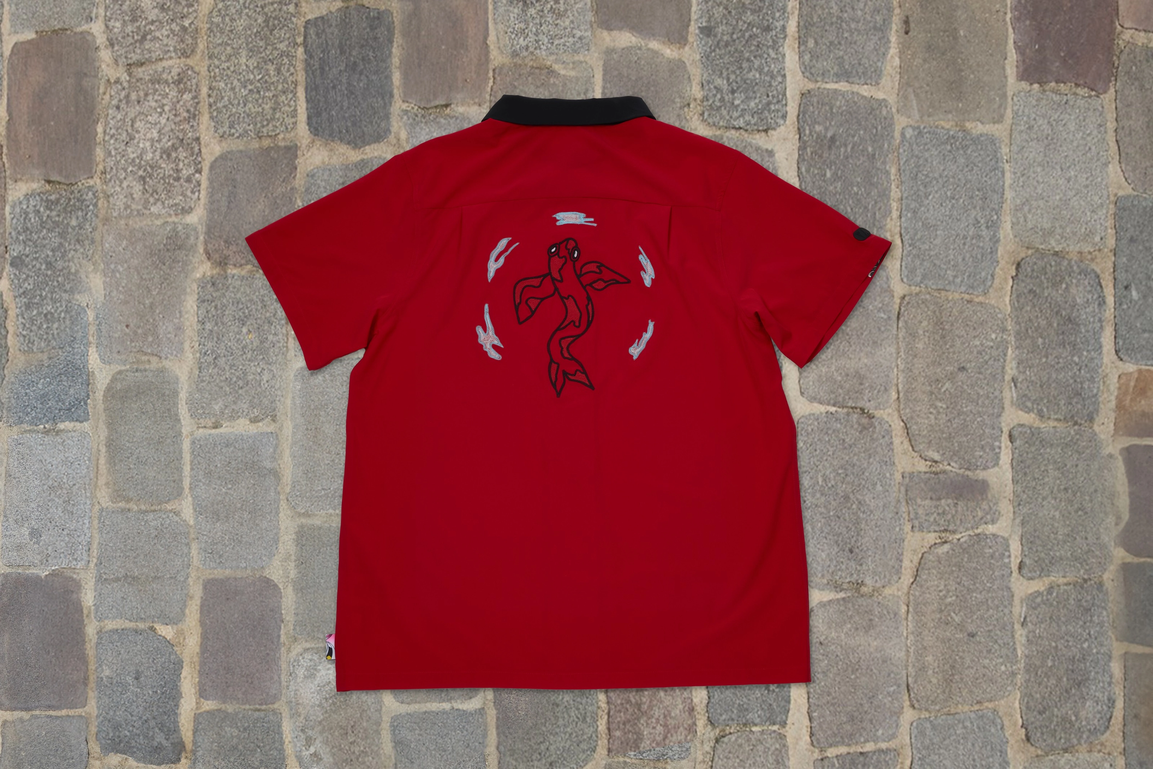 Back view of the red shirt from the Japan skateboarding federation kit featuring a koi fish.