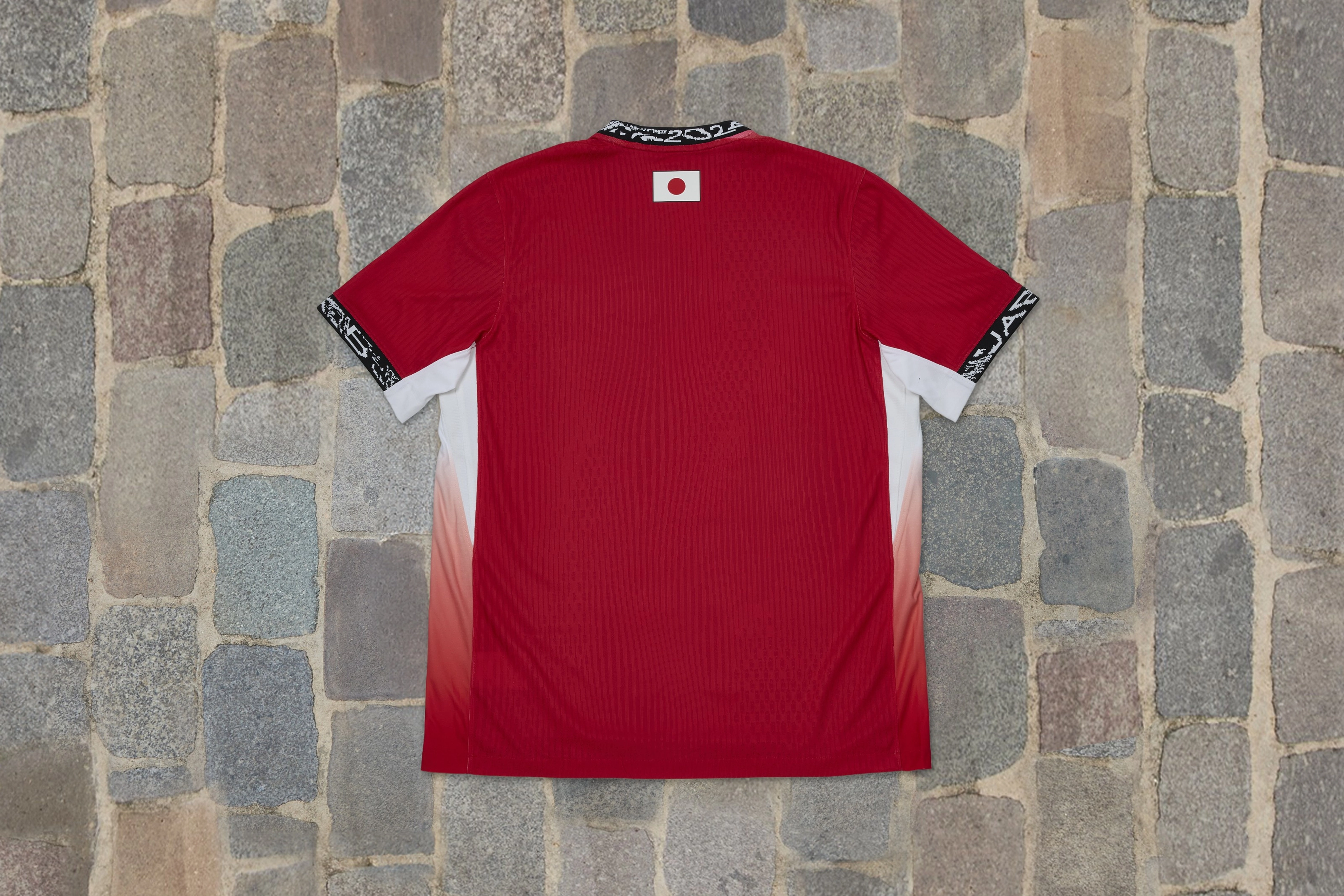 Overhead view of a shirt in cherry blossom colors from the Japan skateboarding federation kit