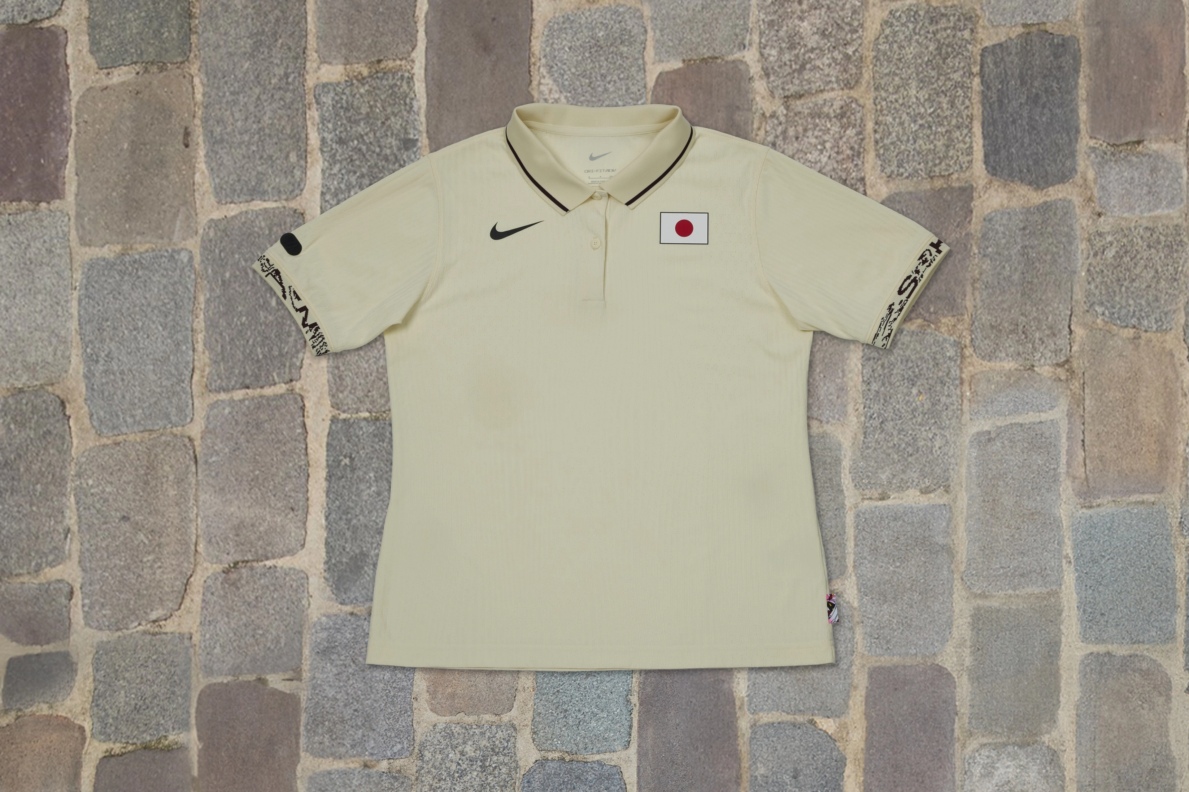 Overhead view of the short sleeve shirt from the Japan skateboarding federation kit