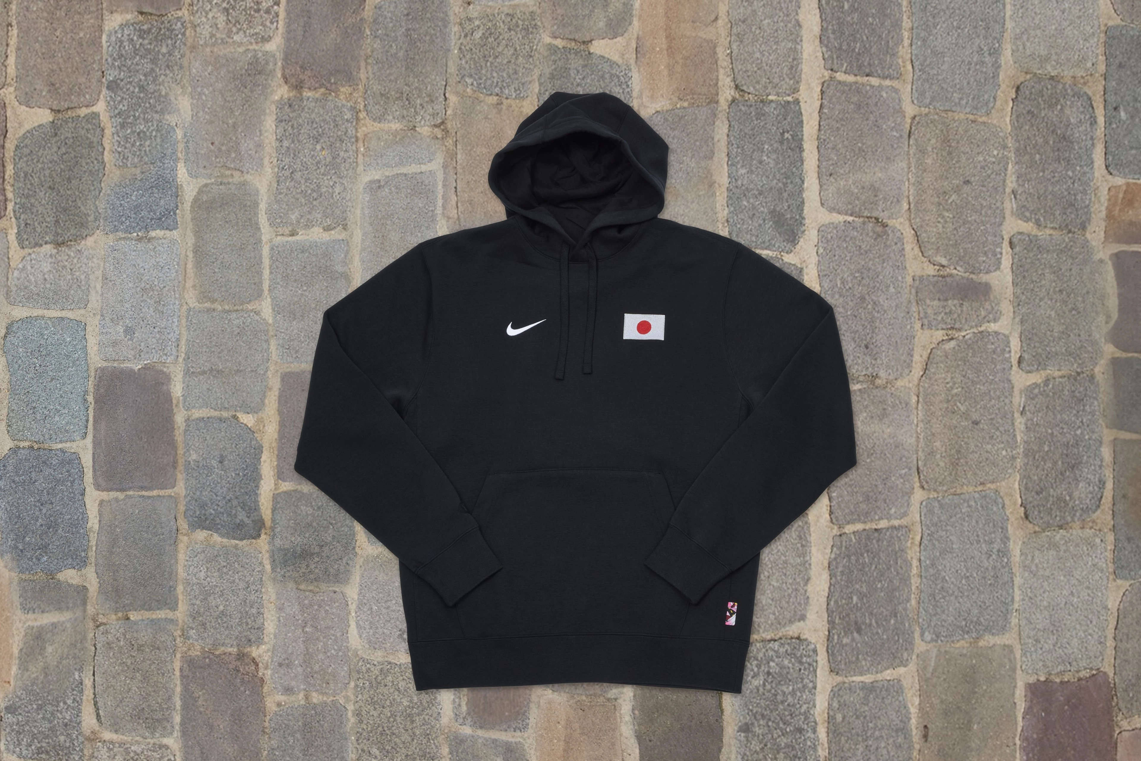 Overhead view of a black hoodie from the skateboarding federation kit for Japan.